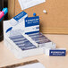 A blue and white box of Staedtler Mars white plastic erasers.