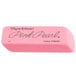 A close-up of a Paper Mate Pink Pearl eraser with black writing on a pink background.