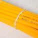 A bunch of Universal beige rubber bands around a bunch of pencils.