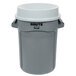 A grey Rubbermaid trash can with a white funnel top lid.