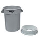 A grey plastic Rubbermaid BRUTE trash can with a funnel top lid.
