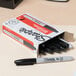 A box of 12 black Sharpie fine point permanent markers.