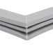 A grey plastic corner piece for a Traulsen magnetic door gasket.