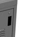 A gray metal locker with a locking handle.