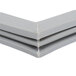A Traulsen magnetic door gasket corner with two pieces of plastic.