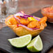 A Tablecraft fry basket filled with tortilla taco cups.