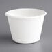 An EcoChoice bagasse portion cup with a white lid.