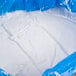 A close-up of a white liquid in a blue plastic bag.