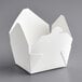 A white paper take-out box with a lid.