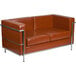 A brown leather loveseat with metal legs.