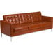 A Flash Furniture Hercules Lacey Cognac leather sofa with metal legs.