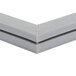 The corner of a gray metal Traulsen refrigerator door gasket.
