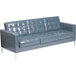 A grey leather sofa with silver legs.