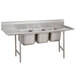 A stainless steel Advance Tabco three compartment sink with two drainboards.