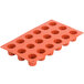 A Matfer Bourgeat orange silicone mini cannele mold with 18 compartments.