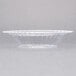 A clear Fineline disposable plastic bowl.