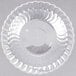 A clear plastic bowl with a scalloped edge.