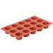 A Matfer Bourgeat orange silicone mini muffin mold with 15 compartments.