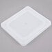 A white plastic lid for a Vollrath stainless steel steam table pan.