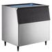 A stainless steel and black Hoshizaki ice storage bin with a blue lid.