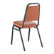 A brown stackable chair with a 2-inch padded seat and black metal frame.