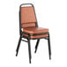 A brown stackable chair with a 2-inch padded seat and black metal frame.