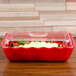 a red and white casserole dish with a clear lid