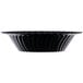 A close-up of a Fineline black plastic bowl with wavy edges.