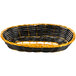 A close up of a black and yellow Thunder Group rattan cracker basket.