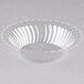 A clear plastic bowl with a scalloped edge.