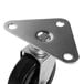 A metal plate with 4 black rubber swivel wheels.