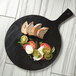 Sliced bread on an American Metalcraft black melamine serving peel.