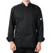 A man wearing a black Mercer Culinary chef coat.