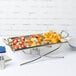 A small rectangular stainless steel tray with food on it.