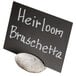 An American Metalcraft gray stone card holder with a white oval chalkboard sign.