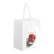 A white bag with a "Country Fresh - Junior" logo and apples.