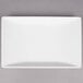 An American Metalcraft white rectangular trapezoid melamine serving platter.