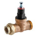 A brass Hatco pressure reducing valve with a red valve handle.