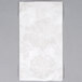 A white Hoffmaster guest towel with a floral design.
