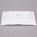 A white rectangular porcelain platter with bamboo pattern in green.