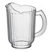 A clear plastic pitcher with a handle.