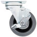 A close-up of a metal wheel with a rubber wheel and a screw.