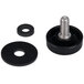 A black round object with a hole in the middle and a black screw and washers.