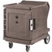 A large brown Cambro hot food holding cabinet on wheels.