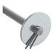A metal rod with a round object on one end.