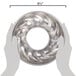 A person holding a Gobel Tin Plate Trois Freres Mold, a silver metal pan with a circular design.