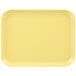 A yellow Cambro tray with a white border.