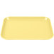 a yellow rectangular tray on a white background