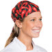 A woman wearing an Intedge chef bandana with a chili pepper pattern.