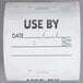A roll of white paper National Checking Company Use By labels with black text.